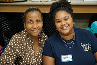 Two volunteers smiling. Links to Beneficiary Designations